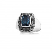 Sterling silver or white gold with antique finish and blue zircon